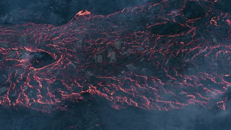 Above-lava-field-flowing-on-earths-crust-with-top-layer-solidifying-and-cracked