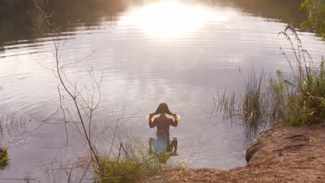 Seductive-Girl-On-Shallow-Water-Of-Blue-Lake-In-North-Stradbroke-Island,-Queensland-Australia