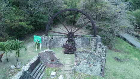 Historical-waterwheel-in-the-fishing-village-of-Seyside,-Tobago