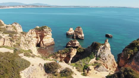 Panoramic-view-of-emerald-Atlantic-Ocean-coast-of-Lagos,-Algarve,-Portugal
