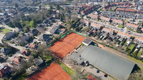 Stunning-aerial-of-tennis-courts-in-a-small-town