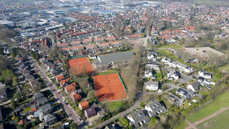 Aerial-of-tennis-courts-in-a-suburban-neighborhood