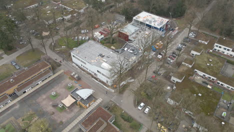 Aerial-of-large-building-under-construction-in-a-small-town