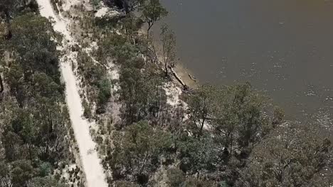 Outdoor-nature-pan-down-Australia-river-muddy-drone-aerial