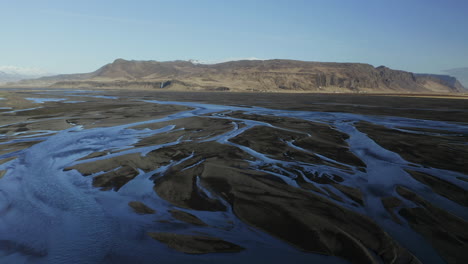Beautiful-Markarfljot-River-in-Iceland-by-the-mountains--aerial