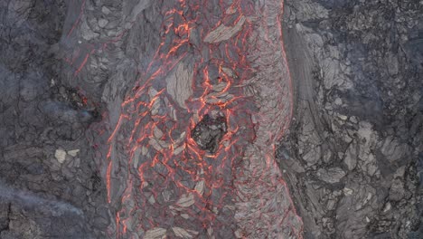 Flowing-lava-river-from-a-volcano-eruption-in-South-Iceland--top-view