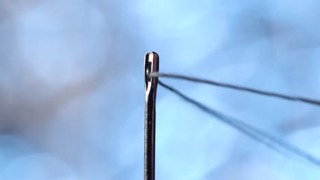 Threading-a-needle-in-macro-scale
