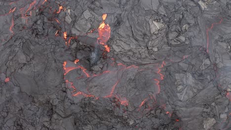 Fume-Rising-From-Red-Lava-On-Volcanic-Eruption-At-Fagradalsfjall-In-Reykjanes-Peninsula,-Reykjavik-Iceland