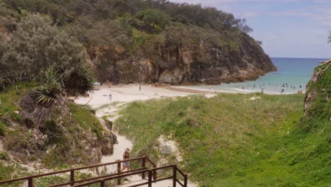 Coastal-Vegetation-On-Headland-Park-With-Tourists-At-Main-Beach-In-Point-Lookout,-North-Stradbroke-Island,-QLD-Australia