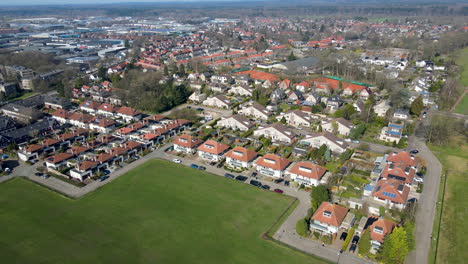 Aerial-of-suburban-neighborhood-in-small,-green-town