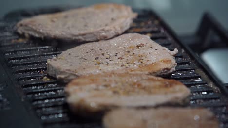 Slow-Motion-Of-Smoke-Coming-Off-Of-Grilled-Steaks