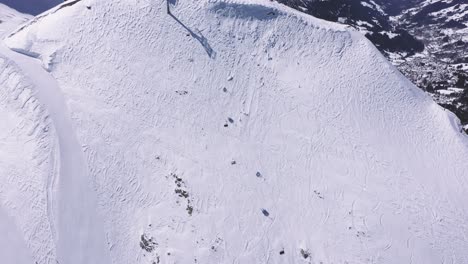 Stunning-drone-footage-high-over-a-ski-run-in-the-Swiss-Alps
