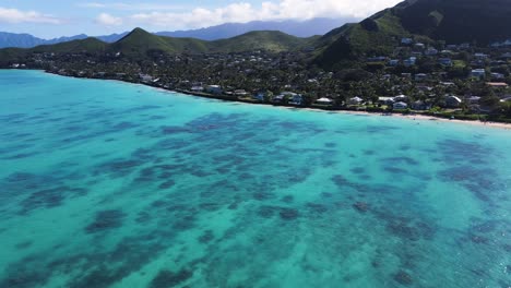 Aerial-circling-over-turquoise-sea-waters-of-Lanikai-Beach-on-Oahu-island,-Hawaii