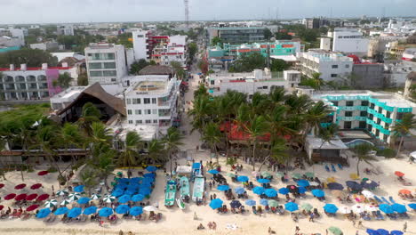 Revealing-drone-shot-of-coastal-town-of-Playa-Del-Carmen-revealing-the-ocean-and-resorts