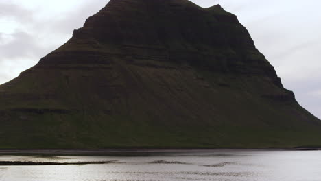 Mountain-in-the-middle-of-water,-Snaefellsnes-Peninsula,-Iceland,-medium-shot