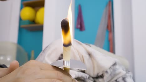 Close-up-of-ear-candling-to-remove-the-buildup-of-ear-wax