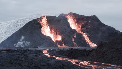 Lava-spitting-volcano-in-Iceland,-Magma-erupting-from-crater,-Fagradalsfjall