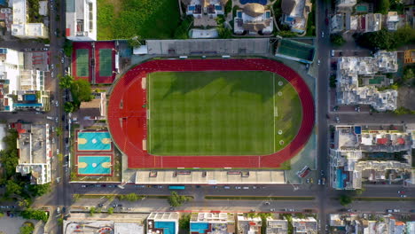 Rising-drone-shot-of-sports-field-in-the-city-of-Playa-Del-Carmen-Mexico