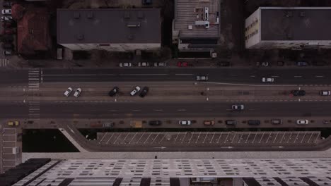 Tram-Line-Blocked-By-Cars-And-City-Buildings,-Overhead-Aerial-Shot