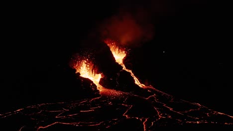 Nighttime-at-active-effusive-volcano-with-exploding-magma-from-earth-mantle