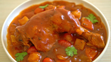 homemade-chicken-stew-with-tomatoes,-onions,-carrot-and-potatoes-on-plate