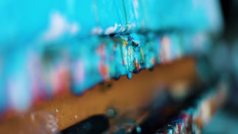 Wet-paint-dripping-from-the-table-of-the-artist-painter