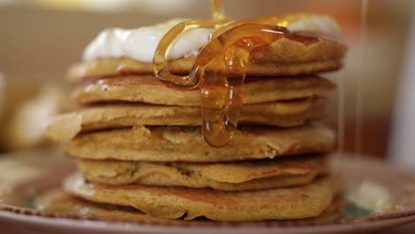 Pouring-Honey-on-Pancakes-Stacked-in-Pile,-Slow-Motion-in-Extreme-Close-Up