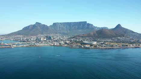 Panorama-Of-Cape-Town-With,-Table-Mountain,-Lion's-Head-Mountain,-And-Stadium-From-The-Ocean-In-South-Africa