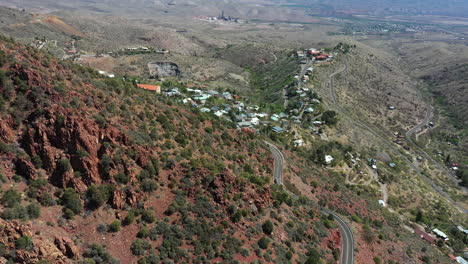 Aerial-View-of-Jerome,-Old-Copper-Mining-Town-in-Arizona,-USA,-Verde-Valley-and-Landscape-on-Sunny-Day,-Drone-Shot