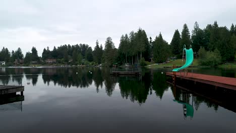 Scenic-Swimming-Dock-With-Reflections-On-Pristine-Pipe-Lake-In-Washington-State