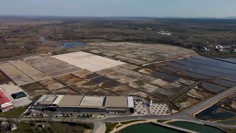 High-drone-flight-next-to-a-salt-field-in-Croatia-at-daytime-next-to-town-Nin