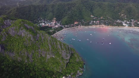 Aerial-view-of-beautiful-karst-scenery-and-turquoise-ocean-waters-around-El-Nido,-Palawan,-Philippines