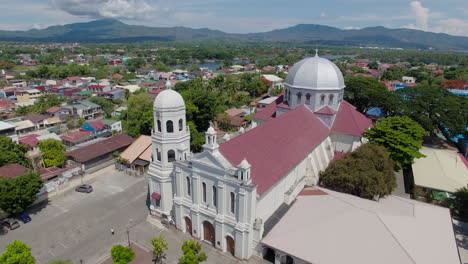 A-Basilica-Church-in-the-town-with-a-landscape-view-of-Batangas,-Philippines,-A-drone-view