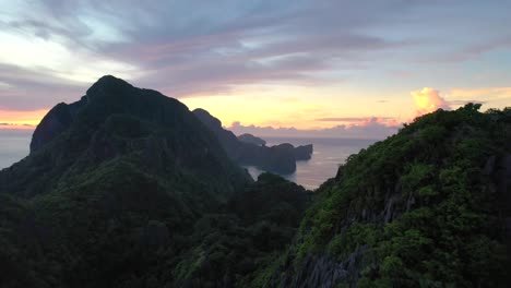 Aerial-Sunset-seascape-of-tropical-islands-in-El-Nido,-Palawan,-The-Philippines-during-sunset