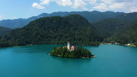 Scenic-View-Of-Bled-Island-And-The-Pilgrimage-Church-of-Assumption-of-Mary-In-Slovenia---aerial-shot