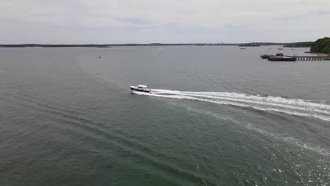 Motorboat-Leaving-Wake-While-Sailing-Across-Hull-Gut-In-Boston-Harbor,-Massachusetts