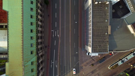 Top-Down-View-Of-City-Road-With-Vehicles-Passing-In-Bremen,-Germany---aerial-drone-shot
