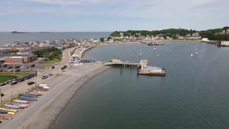 Aerial-drone-footage-near-Hull-Gut,-Hull,-MA-USA,-COAST-GUARD-STATION-and-commuter-dock-in-view