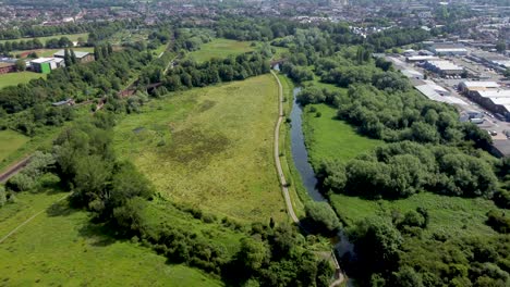 Smooth-4K-drone-footage-over-the-River-Stour-going-through-Hambrook-Marshes