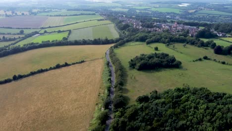 4K-drone-footage-flying-high-over-a-country-road-in-Kent,-UK