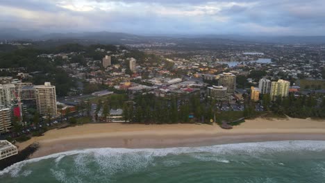 Hotel-Structures-At-The-Waterfront-Of-Burleigh-Beach-With-A-Distant-View-Of-Burleigh-Lake