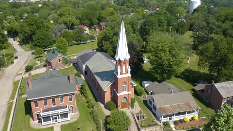 Aerial-Orbiting-Shot-Above-Beautiful-Traditional-Christian-Church-Small-Town-USA