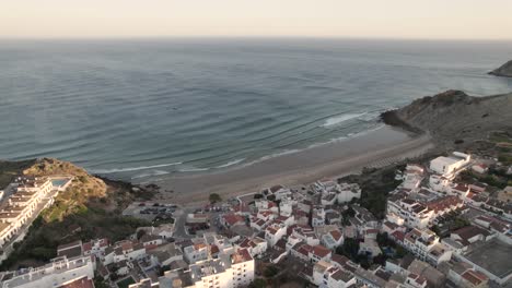 Panoramic-aerial-view-of-a-small-beach-of-Praia-do-Burgau,-Algarve-Budens-Portugal