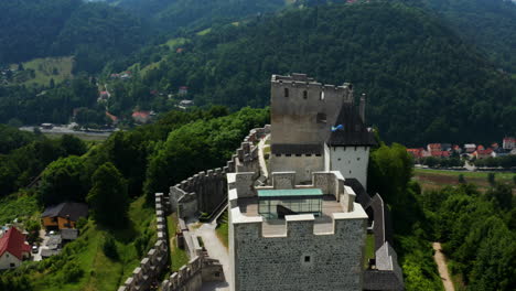 Aerial-View-Of-Celje-Castle-Overlooking-The-Town-At-Daytime-In-Celje,-Slovenia