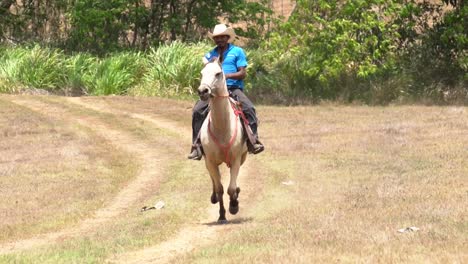 A-cowboy-in-Costa-Rica,-riding-a-running-horse