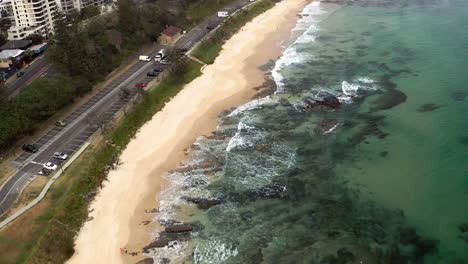 Waves-Crashing-On-Rocky-Coast-Of-Mooloolaba-Beach-In-Maroochydore,-Sunshine-Coast-Region,-Queensland,-Australia