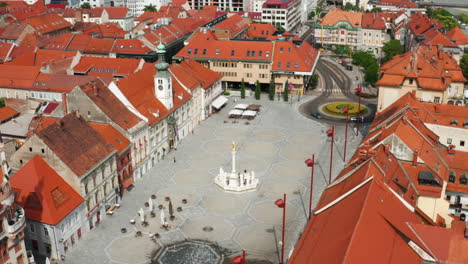 Aerial-View-Of-Plague-Column-At-Main-Square-With-Maribor-Town-Hall-In-Slovenia-During-Pandemic