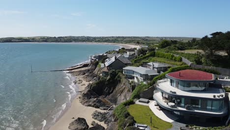 Beautiful-large-houses-overlooking-beach-at-Abersoch,-Wales-UK-aerial-