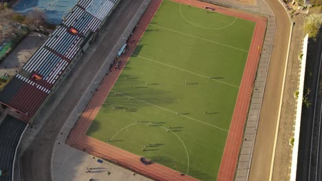 Aerial-top-down-view-showing-players-having-a-hockey-match-at-the-stadium