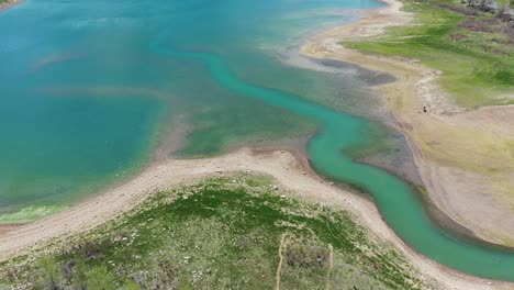 Rifle-Gap-Dam,-Aerial-View-of-Turquoise-Water-Reservoir-in-Rifle-State-Park,-Colorado-USA,-Drone-Shot